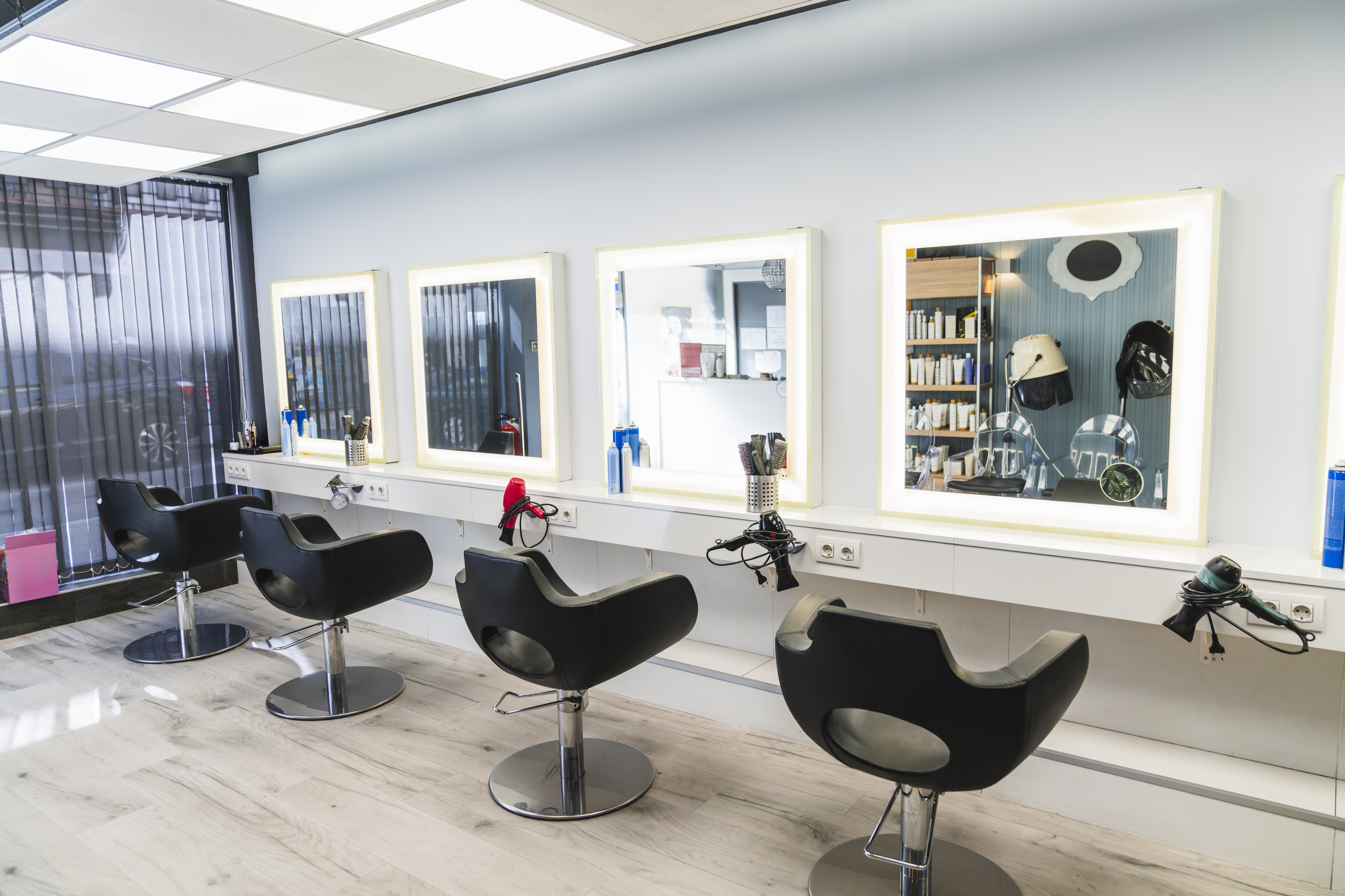 The Curl Collective salon interior with styling chairs